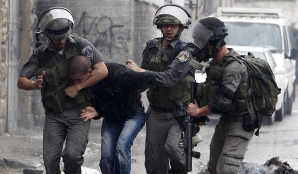 Israeli forces detains a Palestinian youth