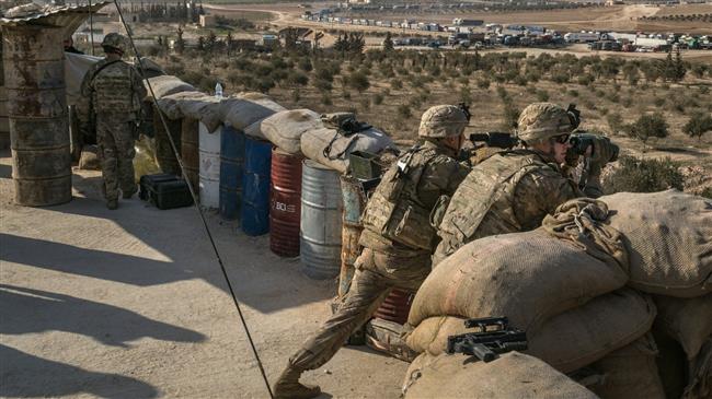 American Special Forces soldiers scanned the area at a front line outpost outside the northern Syrian city of Manbij this month. (Photo by The New York Times)
