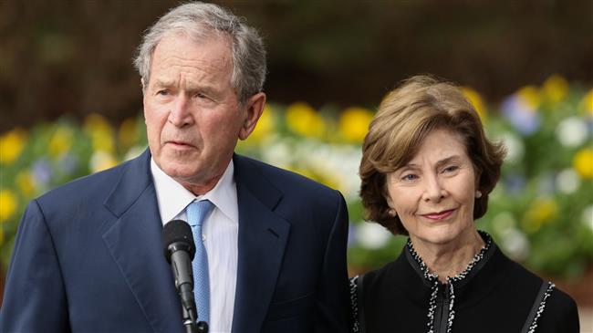 Former US President George W. Bush and First Lady Laura Bush address the media at The Billy Graham Library. (AFP file photo)
