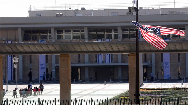 File photo of American flags placed outside the Knesset building in Jerusalem al-Quds on January 21, 2018 (Photo by AFP)
