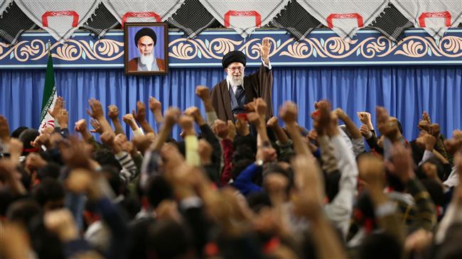 Leader of the Islamic Revolution Ayatollah Seyyed Ali Khamenei waves at a group of teenagers and youths during a meeting in Tehran on March 10, 2018. (Photo by Leader.ir)
