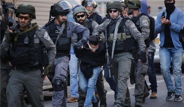 Israeli forces capture a Palestinian man