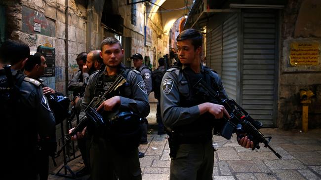 Israeli forces stand guard at the site of an alleged stabbing attack in the Old City of Jerusalem al-Quds on March 18, 2018. (Photo by AFP)
