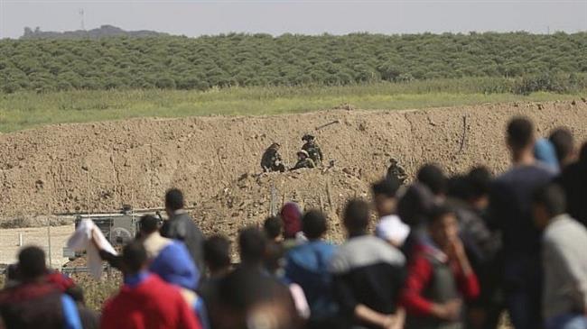 Palestinians gather during a protest near the Gaza fence in eastern Gaza City, March 31, 2018. (Photo by AP)
