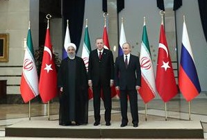 Iranian President Hassan Rouhani (L), Turkish President Recep Tayyip Erdogan (C) and Russian President Vladimir Putin pose for a photo ahead of the Turkey-Russia-Iran tripartite summit in Ankara, Turkey, on April 04, 2018. (Photo by president.ir)

