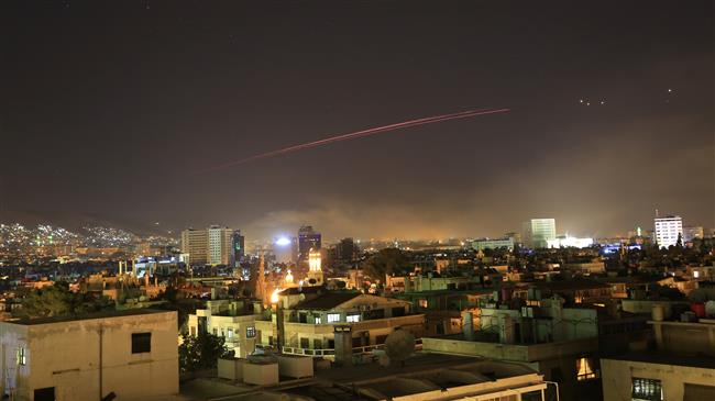 Damascus skies erupt with anti-aircraft fire as the United States launches an attack on Syria targeting different parts of the Syrian capital Damascus early April 14, 2018. (Photo by AP)