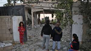 Palestinian children check the house of prisoner Ahmad Jamal al-Qumbaa after it was demolished by Israeli forces in the West Bank city of Jenin on April 24, 2018. (Photo by AFP)
