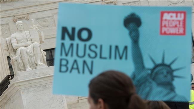Activists rally against the Muslim ban on the day the Supreme Court hears arguments in Hawaii v. Trump in front of the court in Washington, DC, on April 25, 2018. (Photo by AFP)
