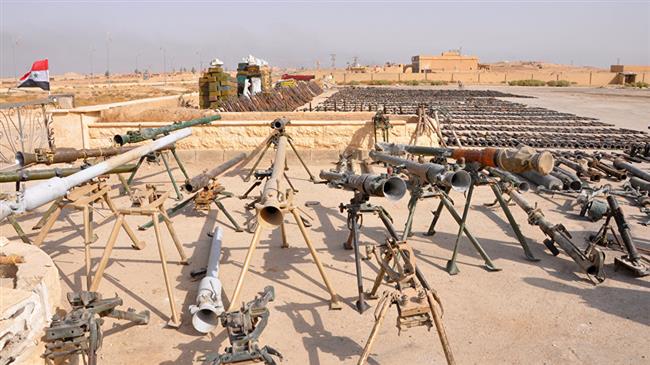 A picture taken on November 5, 2017, shows weapons seized by Syrian government forces during a military operation against Daesh Takfiri terrorists in the eastern city of Dayr al-Zawr. (Photo by AFP)
