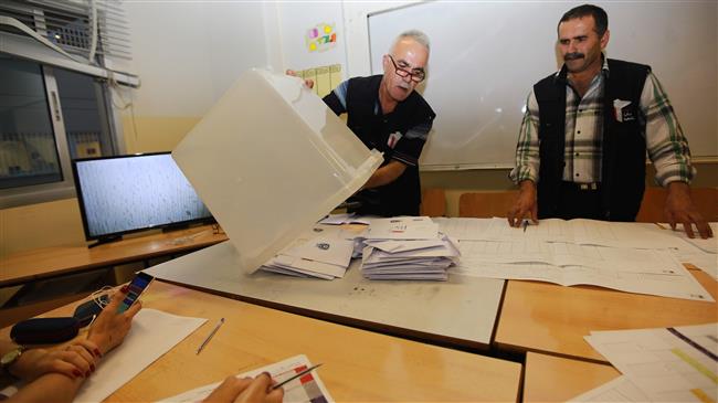Lebanese officials count votes at a polling center in Beirut after polling stations closed for Lebanon