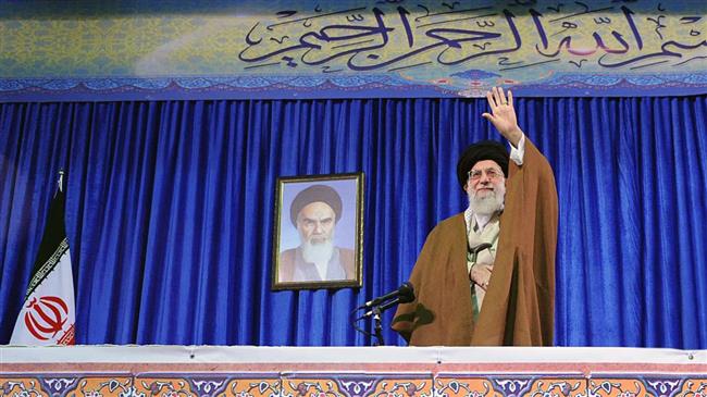 Leader of the Islamic Revolution Ayatollah Seyyed Ali Khamenei waves at a group of Iranian teachers and university professors in Tehran on May 9, 2018. (Photo by khamenei.ir)
