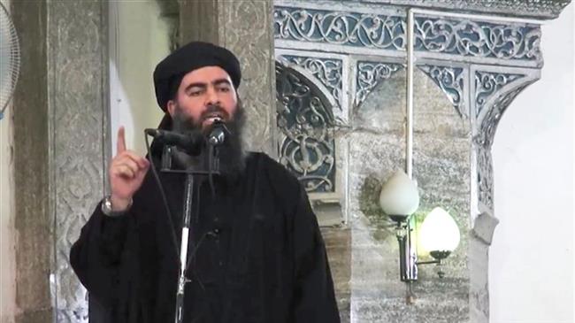 This image made from video posted on a militant website shows the purported leader of the Daesh Takfiri terrorist group, Ibrahim al-Samarrai aka Abu Bakr al-Baghdadi, delivering a sermon at a mosque in Iraq. (Photo by AP)
