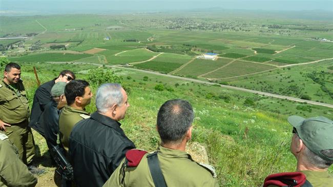 Israeli PM Benjamin Netanyahu (3rd R) is seen during a tour in the occupied Golan Heights, April 11, 2016.

