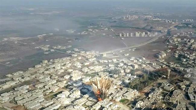 This file photo purportedly shows a school being blown in a rocket attack by Tahrir al-Sham terrorists in the Syrian city of Dara