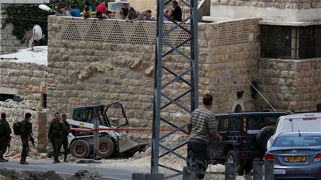 Israeli soldiers stand at the scene of the fatal shooting of a Palestinian in the West Bank city of al-Khalil (Hebron) on June 2, 2018. (Photo by Reuters) Embed Download