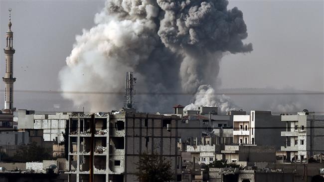In this file picture, smoke rises from the Syrian town of Ayn al-Arab, known as Kobane by the local Kurds, after a strike by the so-called US-led coalition as it is seen from the Turkish-Syrian border in the southeastern village of Mursitpinar, Sanliurfa province. (Photo by AFP)