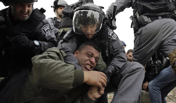 Israeli Forces capture a Palestinian man