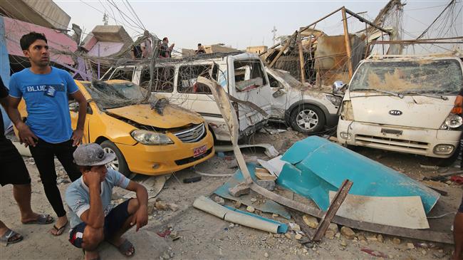 People inspect the aftermath of an explosion in Baghdad