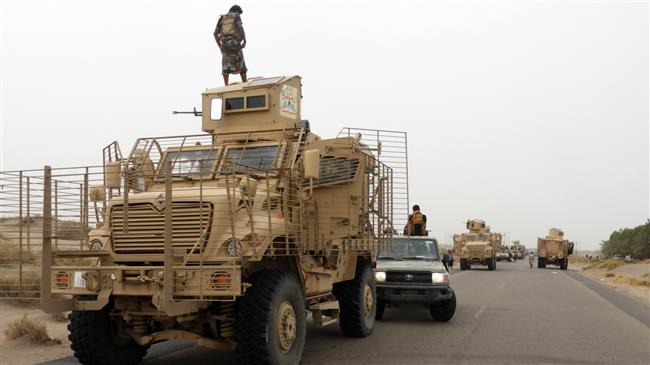 Yemeni militia, loyal to former president Abd Rabbuh Mansur Hadi, and armored vehicles arrive in al-Durayhimi district, some nine kilometers south of Hudaydah International Airport, on June 13, 2018. (Photo by AFP)
