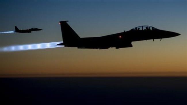 In this file picture, a pair of US Air Force F-15E Strike Eagles flies over northern Iraq after conducting airstrikes in Syria. (Photo by US Air Force)