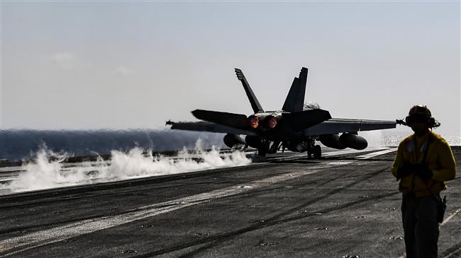 An F18 Hornet fighter jet pilot takes off from the deck of the US navy aircraft carrier USS Harry S. Truman in the eastern Mediterranean Sea on May 8, 2018. (Photo by AFP)
