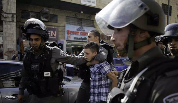 Israeli soldiers arrest a young Palestinian boy