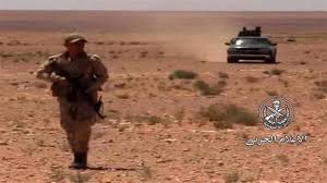 This video grab shows a Syrian soldier patrolling an area in the Badiya region after it was liberated during an offensive, June 20, 2018. (Photo via SANA)