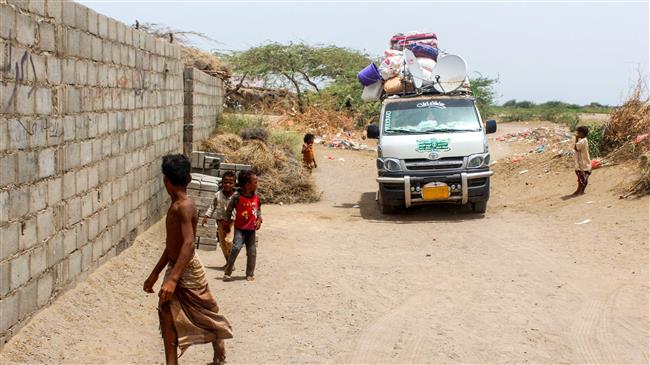 A micro-bus is seen carrying people displaced from the Red Sea port city of al-Hudaydah, June 22, 2018. (Photo by AFP)
