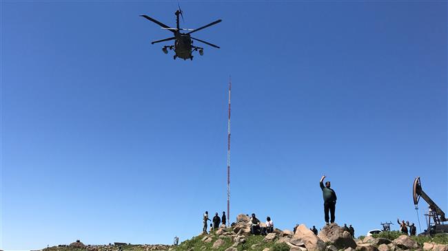 A helicopter carrying US military officials arrives at the headquarters of the Kurdish militants from the so-called People