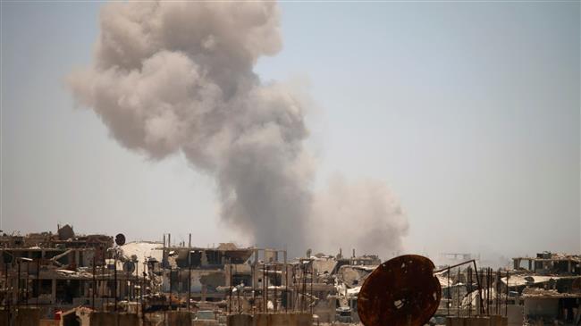 Smoke rises above the Syrian southwestern city of Dara’a on June 25, 2018. (AFP photo)