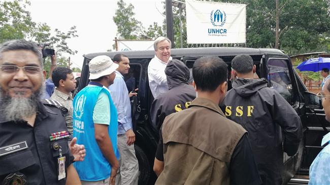UN Secretary-General Antonio Guterres (C) arrives at the Kutupalong refugee camp for the Rohingya community in Bangladesh’s southeastern border district of Cox’s Bazar on July 2, 2018. (Photo by AFP)
