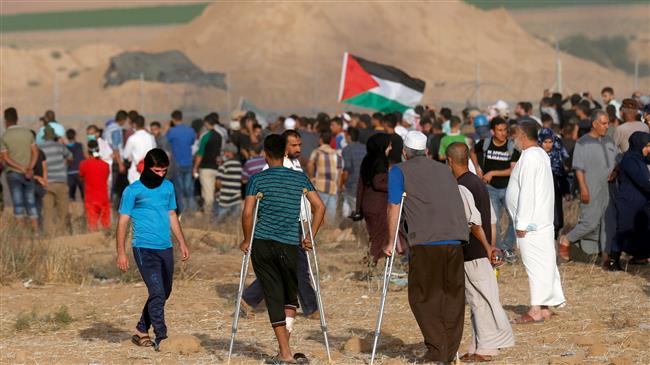 Palestinian protesters gather during a demonstration along the border between the Gaza strip and occupied territories, east of Khan Yunis, in the southern Gaza Strip on June 22, 2018. (Photo by AFP)
