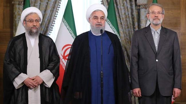 President Hassan Rouhani (C) makes a public announcement after a joint session with Parliament Speaker Ali Larijani (R) and Judiciary Chief Ayatollah Sadeq Amoli Larijani in Tehran, July 14, 2018. (Photo by IRNA)
