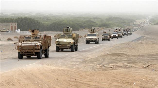 A column of Saudi-led forces and armored vehicles arrives in al-Durayhimi district, about nine kilometers south of Hudaydah International Airport on June 13, 2018. (Photo by AFP)
