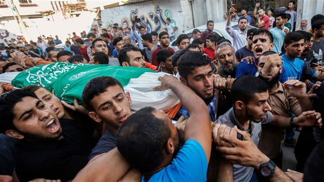 Palestinian mourners carry the body of 23-year-old Sari al-Shobaki during his funeral in Gaza City on July 17, 2018, who died days after being shot by Israeli forces in clashes along the Gaza fence. (Photo by AFP)
