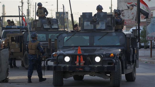 Members of the Iraqi Federal Police patrol the streets of Baghdad