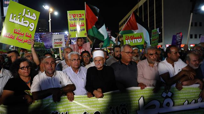 Druze protesters march with Arabs and their supporters during a demonstration against the “Jewish state” law in the city of Tel Aviv on August 11, 2018. (Photo by AFP)
