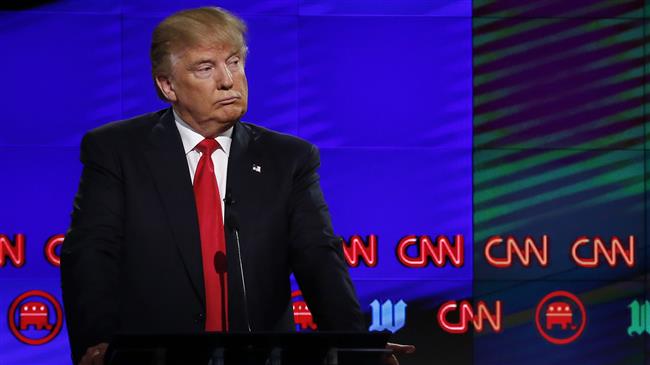 In this file photo taken on March 10, 2016 Donald Trump (L) listens to Texas Senator Ted Cruz (not pictured) speak during the CNN Republican Presidential Debate in Miami, Florida. (Photo by AFP)
