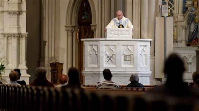 Father Kris Stubna speaks to parishioners during a mass at St Paul Cathedral in Pittsburgh, Pennsylvania, on August 15, 2018. (Getty Images)
