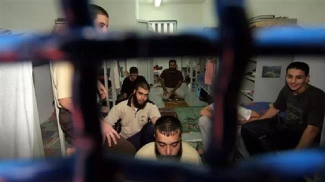 In this file picture, Palestinian security prisoners sit in their cell at Israel