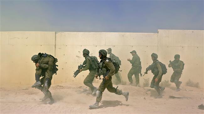 Israeli forces run during a military exercise at the Tzeelime army base in central Israel on July 3, 2018. (Photo by AFP)
