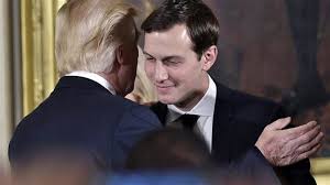 This undated picture shows US President Donald Trump (L) embracing his son-in-law and senior adviser Jared Kushner.