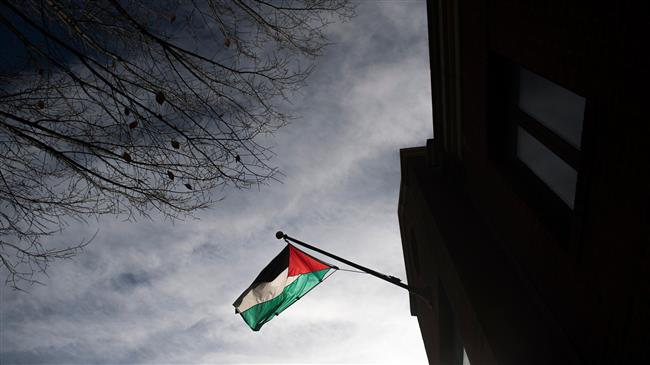 In this file photo, taken on November 21, 2017, a national Palestinian flag is seen at the Palestine Liberation Organization Office in Washington, DC. The US closed that office last week. (By AFP)
