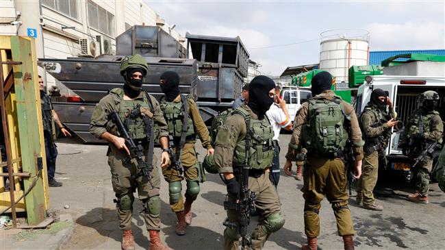 Israeli forces gather at the site of a reported attack at the Barkan Industrial Park near the Israeli settlement of Ariel in the occupied West Bank on October 7, 2018. (Photo by AFP)
