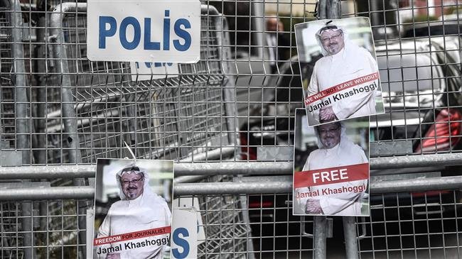 Pictures of missing journalist Jamal Khashoggi are seen on police fence during a demonstration in front of the Saudi Arabian consulate on October 8, 2018 in Istanbul. (Photo by AFP)
