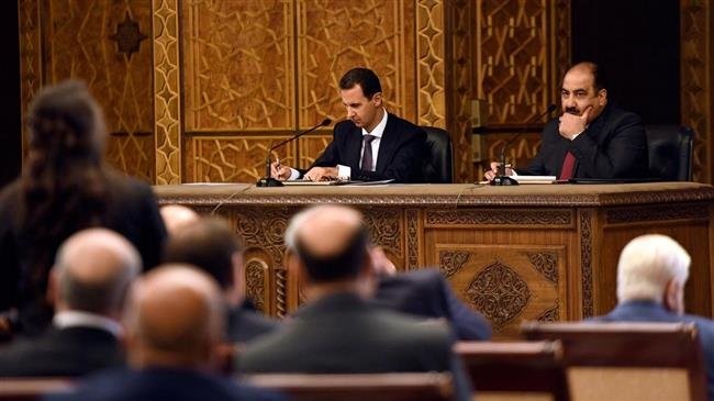 Syrian President Bashar al-Assad (L)
