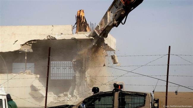 Israeli forces demolishing a Palestinian home in al-Khalil (Hebron), West Bank, on 21 January 2016 (Photo by APA images)
