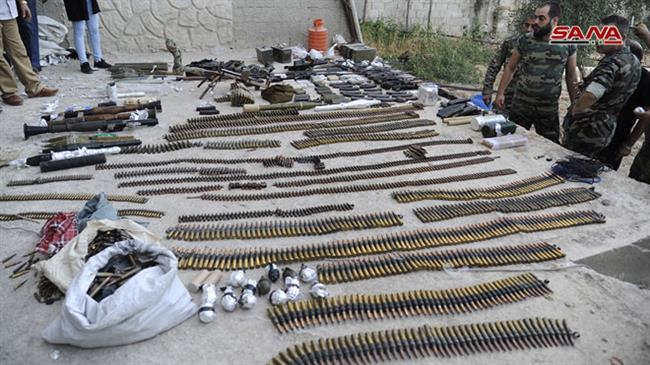 A picture taken on October 14, 2018, shows weapons seized by Syrian security forces during a military operation against foreign-sponsored Takfiri terrorists in the town of Yalda. (Photo by SANA news agency)

