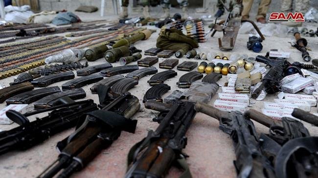 A picture taken on October 14, 2018, shows weapons seized by Syrian security forces during a military operation against foreign-sponsored Takfiri terrorists in the town of Yalda. (Photo by SANA news agency)
