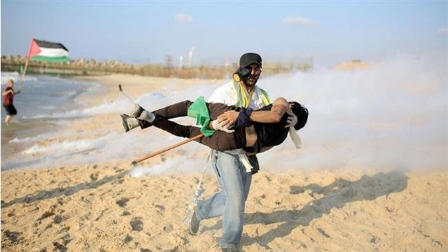 A Palestinian protester is injured in the northern part of the besieged Gaza Strip during a naval rally against the decade-long Israeli siege on the impoverished sliver on October 22, 2018. (Photo via Palestine Chronicle)
